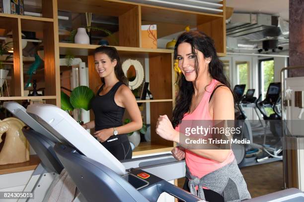 Mariella Ahrens and her daughter Isabella Ahrens train during the Cyberobics Women Club Opening on July 29, 2017 in Berlin, Germany.