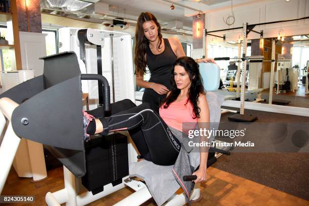 Mariella Ahrens and her daughter Isabella Ahrens train during the Cyberobics Women Club Opening on July 29, 2017 in Berlin, Germany.