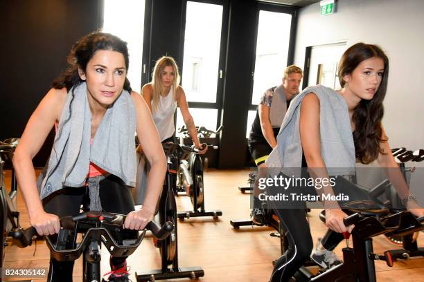Mariella Ahrens and her daughter Isabella Ahrens train during the Cyberobics Women Club Opening on July 29, 2017 in Berlin, Germany.