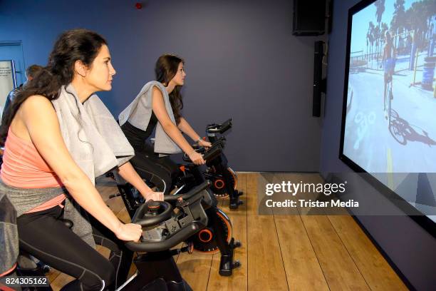 Mariella Ahrens and her daughter Isabella Ahrens train during the Cyberobics Women Club Opening on July 29, 2017 in Berlin, Germany.