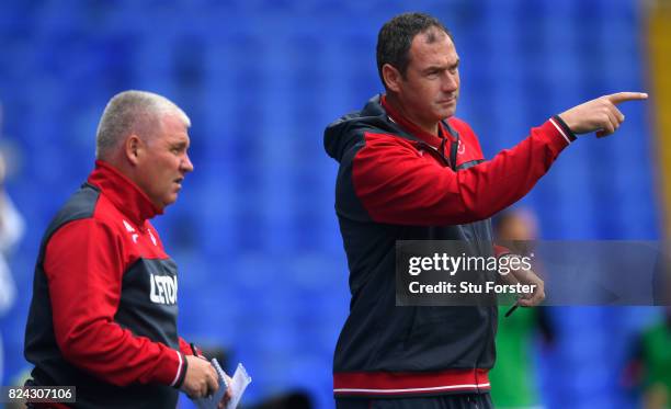 Swansea manager Paul Clement makes a point as coach Nigel Gibbs looks on during the Pre Season Friendly match between Birmingham City and Swansea...