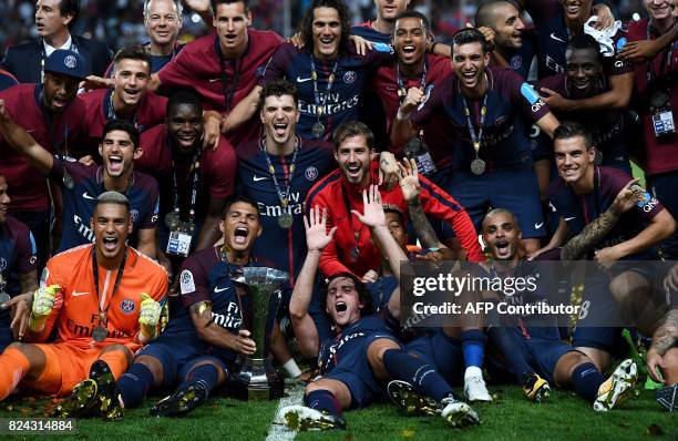 Paris Saint-Germain's players pose with the trophy as they celebrate winning the French Trophy of Champions football match between Monaco and Paris...