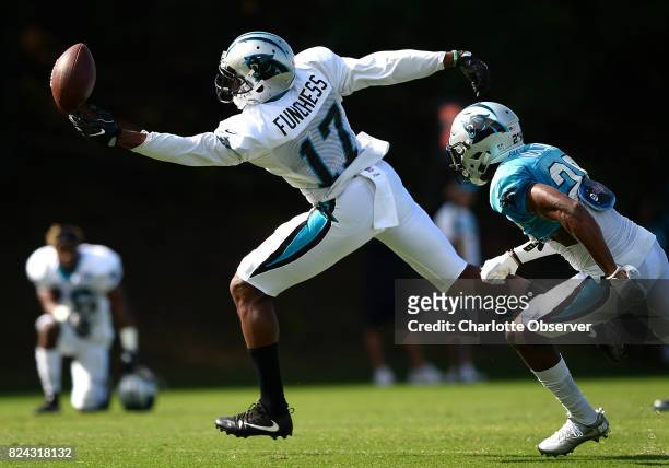 Carolina Panthers wide receiver Devin Funchess, left, is unable to make a one-handed catch as cornerback Daryl Worley, right, applies pressure during...