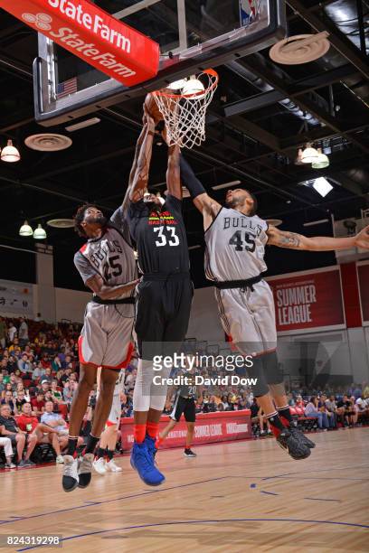 Diamond Stone of the Atlanta Hawks goes for the rebound against Denzel Valentine and Chris Walker of the Chicago Bulls during the 2017 Las Vegas...