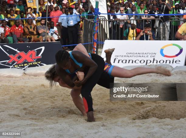 Romania's Linquararu Madalina wrestles against Senegalese Binette Diata in the individual combat 50kg Traditional Wrestling Woman's bout during the...