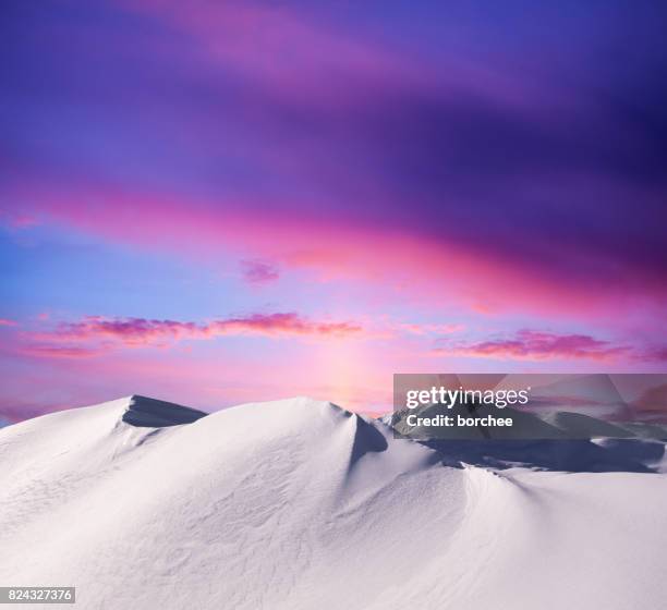 sonnenuntergang in den bergen - moutain sunset snow stock-fotos und bilder