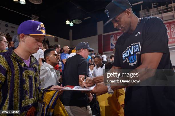 Former NBA player Jerome Williams signs an autograph during the game between the Milwaukee Bucks and the Los Angeles Clippers during the 2017 Las...