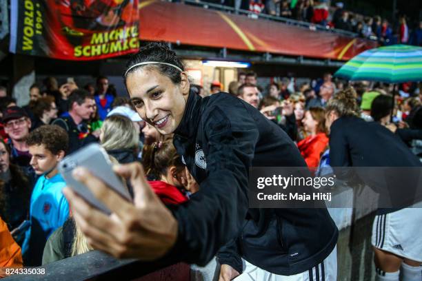 Sara Doorsoun of Germany poses with the fans after the game was postponed due to heavy rain prior to the UEFA Women's Euro 2017 Quarter Final match...