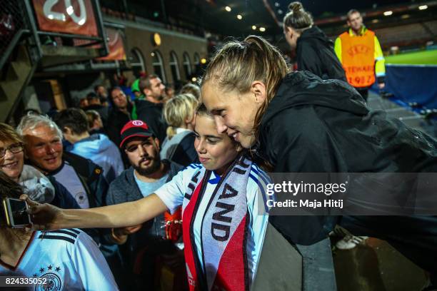 Tabea Kemme of Germany poses with the fans after the game was postponed due to heavy rain prior to the UEFA Women's Euro 2017 Quarter Final match...