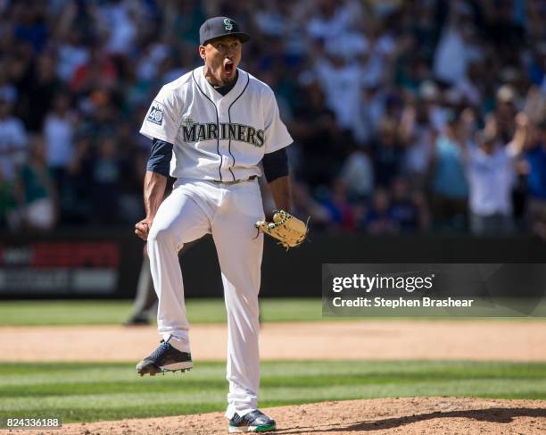 Relief pitcher Edwin Diaz of the Seattle Mariners reacts after the last out of an interleague game against the New York Mets at Safeco Field on July...