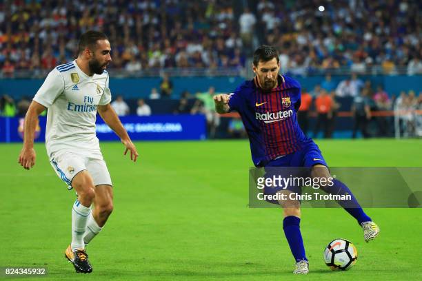 Lionel Messi of Barcelona controls the ball against Daniel Carvajal of Real Madrid in the first half during their International Champions Cup 2017...