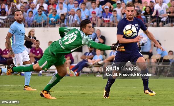 Goaltender Aro Muric of Manchester City makes a save against Vincent Janssen of Tottenham during the second half of the 2017 International Champions...
