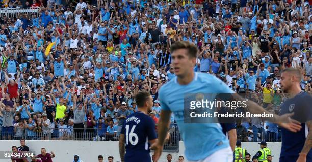 Thousands of fans of Manchester City cheer after John Stones scores a goals against Tottenham during the first half of the 2017 International...