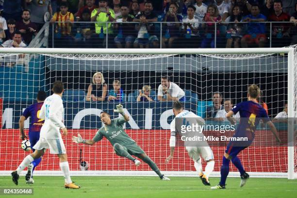 Ivan Rakitic of Barcelona scores a goal in the first half against Real Madrid during their International Champions Cup 2017 match at Hard Rock...