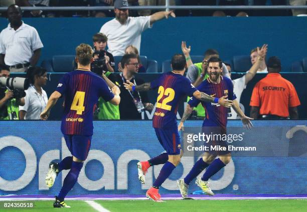 Lionel Messi of Barcelona celebrates his goal with teammates in the first half against the Real Madrid during their International Champions Cup 2017...