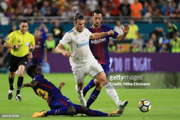 Samuel Umtiti of Barcelona defends against Gareth Bale of Real Madrid in the first half during their International Champions Cup 2017 match at Hard...