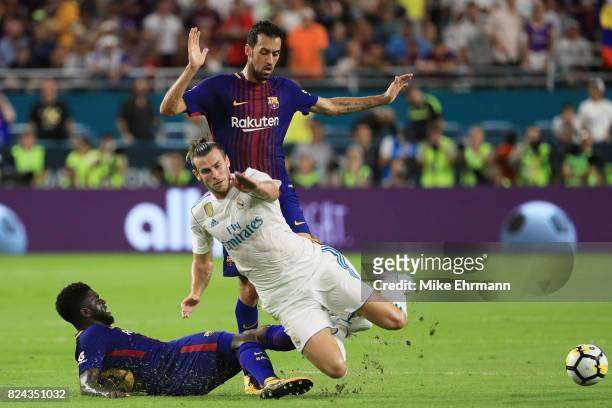 Samuel Umtiti of Barcelona defends against Gareth Bale of Real Madrid in the first half during their International Champions Cup 2017 match at Hard...