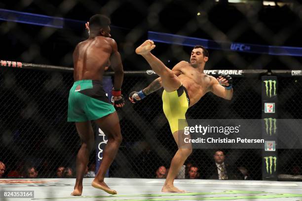 Renan Barao of Brazil kicks Aljamain Sterling in their 140-pound catchweight bout during the UFC 214 event at Honda Center on July 29, 2017 in...