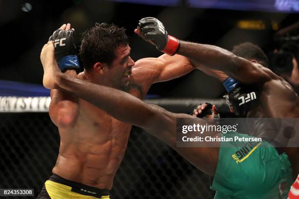 Aljamain Sterling kicks Renan Barao of Brazil in their 140-pound catchweight bout during the UFC 214 event at Honda Center on July 29, 2017 in...