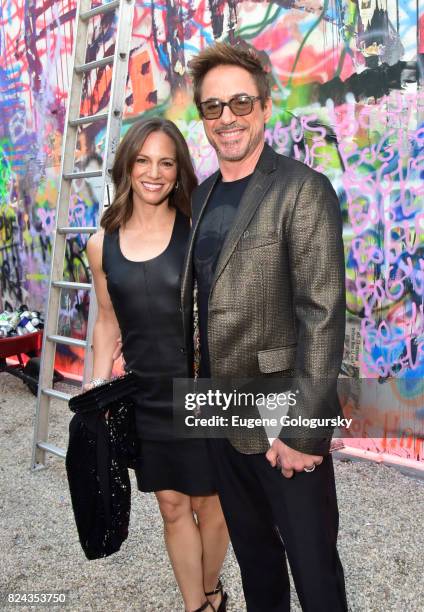 Susan Levin and Robert Downey Jr. Attend Fly Into The Sun: The 24th Annual Watermill Center Summer Benefit The Watermill Center on July 29, 2017 in...