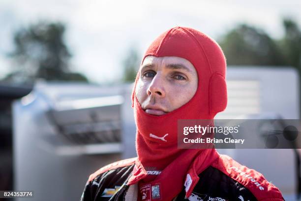 Will Power, of Australia, prepares to drive before practice for the Verizon IndyCar Series Honda Indy 200 at Mid-Ohio Sports Car Course on July 29,...