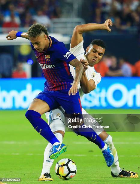 Neymar of Barcelona controls the ball against Casemiro of Real Madrid in the first half during their International Champions Cup 2017 match at Hard...