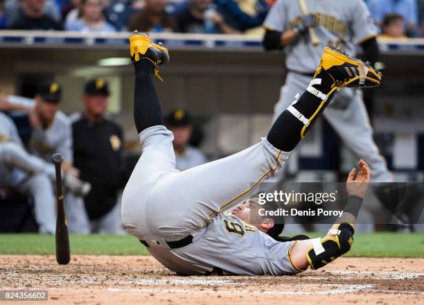 Francisco Cervelli of the Pittsburgh Pirates falls after being brushed back by a pitch during the fifth inning of a baseball game against the San...