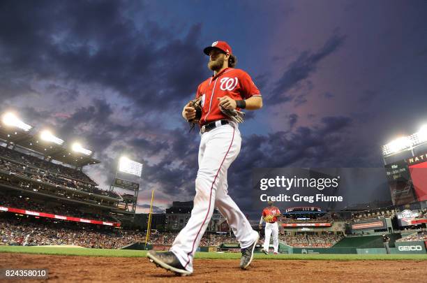 Bryce Harper of the Washington Nationals runs in from the outfield in the sixth inning against the Colorado Rockies at Nationals Park on July 29,...