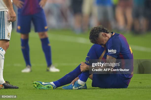 Neymar of Barcelona reacts in pain on the field during their International Champions Cup football match at Hard Rock Stadium on July 29, 2017 in...