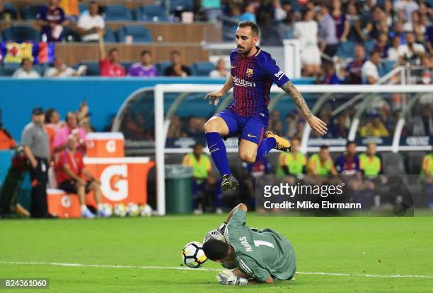 Aleix Vidal of Barcelona jumps over Keylor Navas of Real Madrid in the second half during their International Champions Cup 2017 match at Hard Rock...