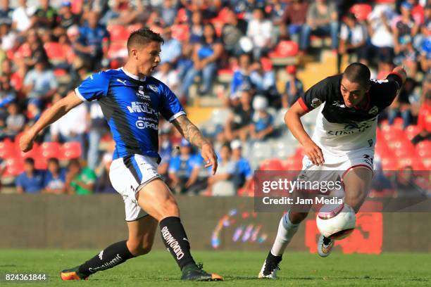 Javier Guemez of Queretaro fights for the ball with Eduardo Tercero of Lobos BUAP, during the 2nd round match between Queretaro and Lobos BUAP as...