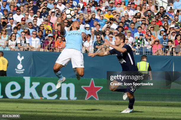 Manchester City forward Gabriel Jesus brings down the ball as he is defended by Tottenham Hotspur defender Ben Davies during the game between...