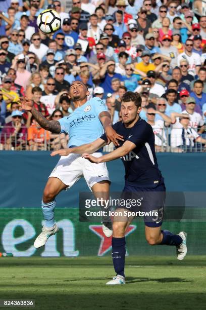 Manchester City forward Gabriel Jesus brings down the ball as he is defended by Tottenham Hotspur defender Ben Davies during the game between...