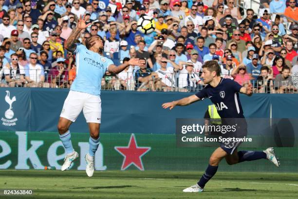 Manchester City forward Gabriel Jesus brings down the ball as he is defended by Tottenham Hotspur defender Ben Davies during the game between...