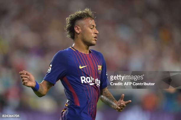 Neymar of Barcelona reacts during their International Champions Cup football match at Hard Rock Stadium on July 29, 2017 in Miami, Florida. / AFP...