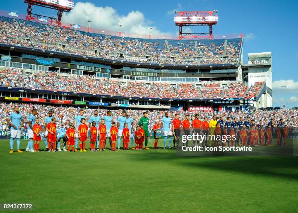 Both teams stand at mid field just prior to the start of the match during the second half of a International Champions Cup match between Tottenham...