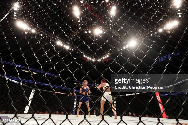 Cris Cyborg of Brazil and Tonya Evinger face-off in their UFC women's featherweight championship bout during the UFC 214 event at Honda Center on...