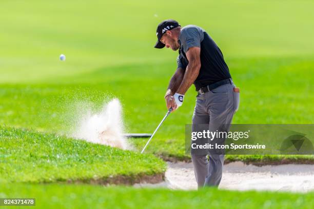 Sam Saunders plays a shot out of a sand trap on the 18th hole during third round action of the RBC Canadian Open on July 29 at Glen Abbey Golf Club...