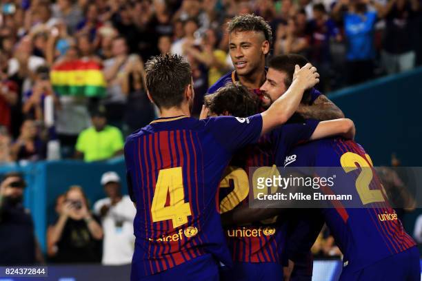 Neymar of Barcelona and teammates celebrate a goal in the second half against Real Madrid during their International Champions Cup 2017 match at Hard...