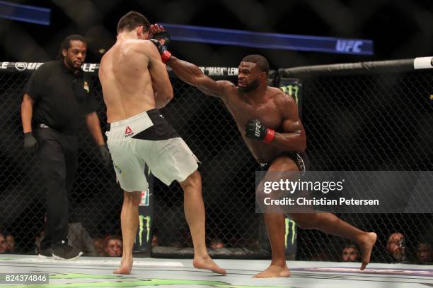 Tyron Woodley punches Demian Maia of Brazil in their UFC welterweight championship bout during the UFC 214 event at Honda Center on July 29, 2017 in...