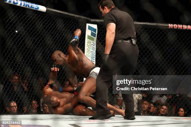 Jon Jones punches Daniel Cormier in their UFC light heavyweight championship bout during the UFC 214 event at Honda Center on July 29, 2017 in...