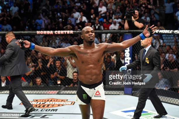 Jon Jones celebrates after knocking out Daniel Cormier in their UFC light heavyweight championship bout during the UFC 214 event at Honda Center on...
