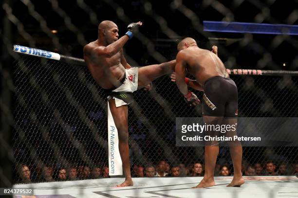 Jon Jones kicks Daniel Cormier in the head in their UFC light heavyweight championship bout during the UFC 214 event at Honda Center on July 29, 2017...