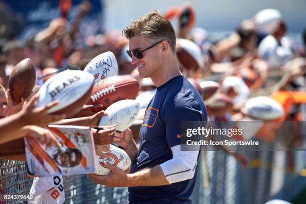 Chicago Bears General Manager Ryan Pace signs autographs for fans after a practice session during the Chicago Bears Training Camp on July 29, 2017 at...