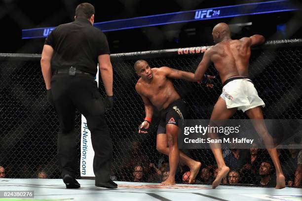 Daniel Cormier tries to evade Jon Jones in the Light Heavyweight title bout during UFC 214 at Honda Center on July 29, 2017 in Anaheim, California.