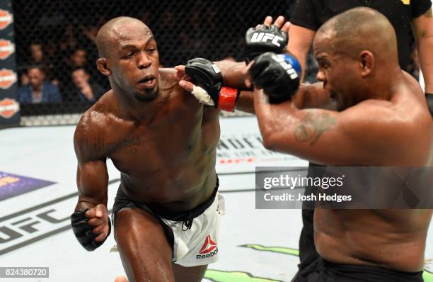 Jon Jones punches Daniel Cormier in their UFC light heavyweight championship bout during the UFC 214 event at Honda Center on July 29, 2017 in...