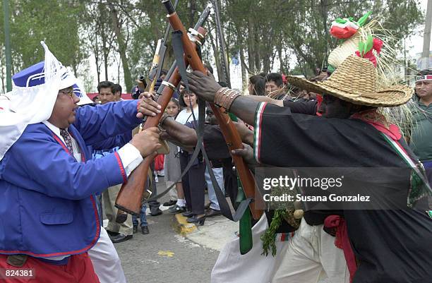 Mexicans celebrate Cinco de Mayo with a reenactment of the 1862 battle between the French and the Zacapuaxtlas Indians May 5, 2001 in Puebla, Mexico....