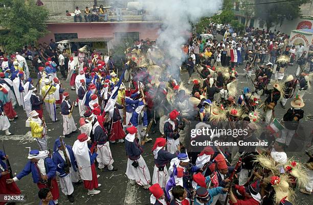 Mexicans celebrate Cinco de Mayo with a reenactment of the 1862 battle between the French and the Zacapuaxtlas Indians May 5, 2001 in Puebla, Mexico....