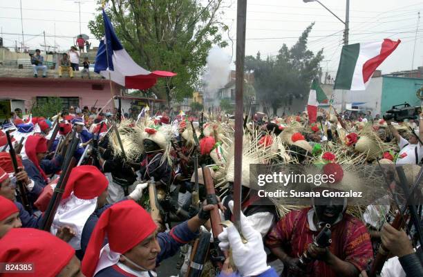 Mexicans celebrate Cinco de Mayo with a reenactment of the 1862 battle between the French and the Zacapuaxtlas Indians May 5, 2001 in Puebla, Mexico....