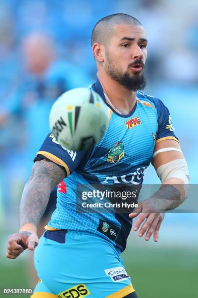 Nathan Peats of the Titans warms up before the round 21 NRL match between the Gold Coast Titans and the Wests Tigers at Cbus Super Stadium on July...